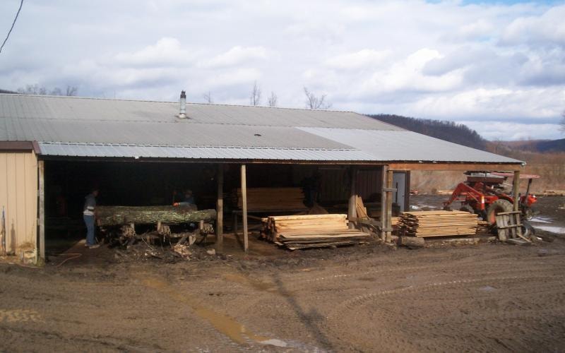 Fox Valley mill shed with stacked lumber and equipment